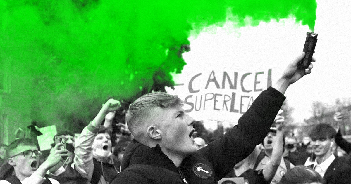 shouting fans with placard and green smoke gun